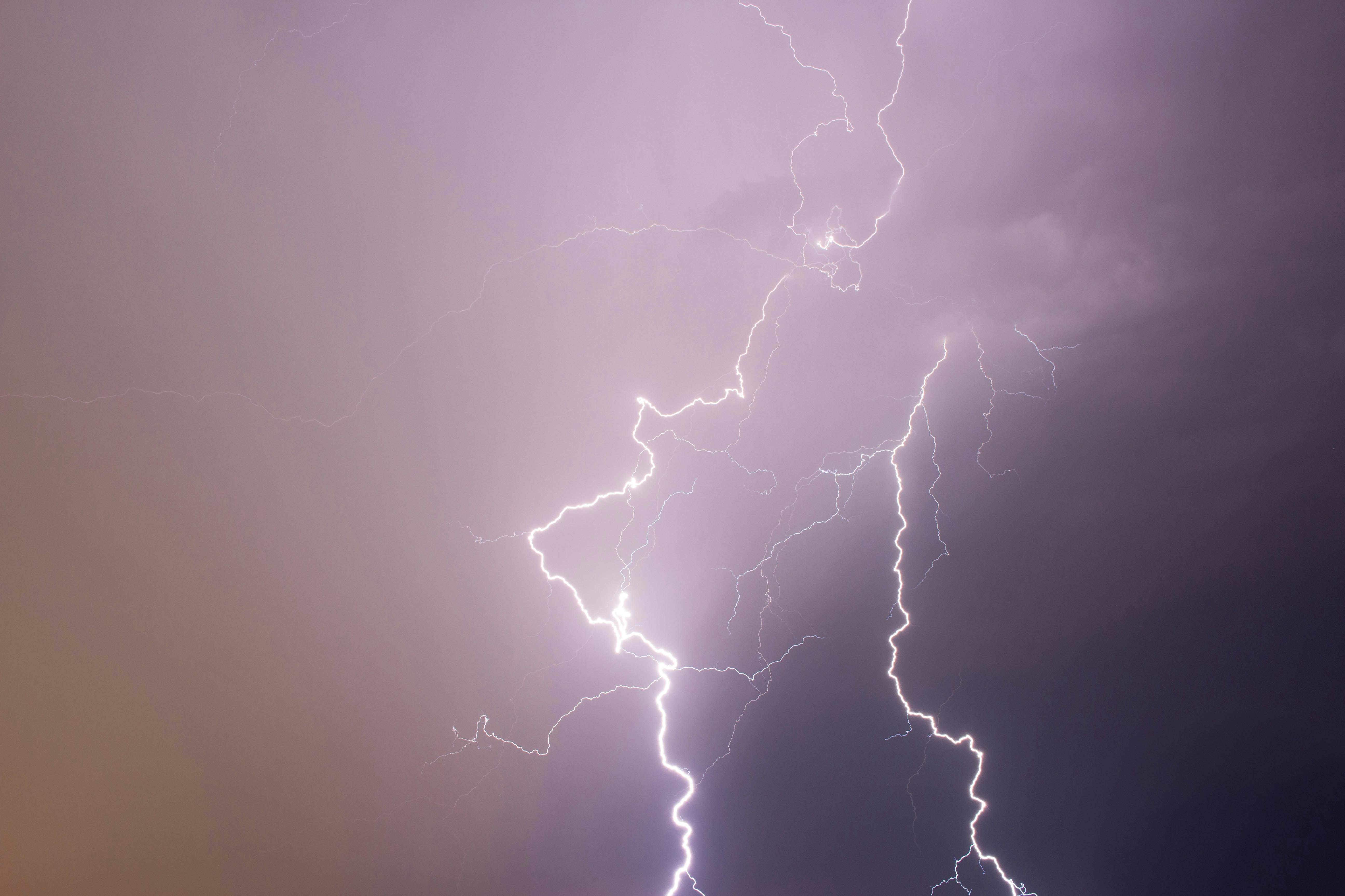 lightning strikes under cloudy storm